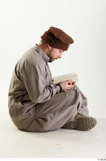 Luis Donovan Afgan Reading Book reading sitting whole body 0002.jpg
